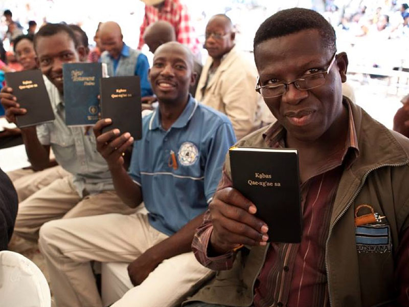 Bible Translators Holding Bibles